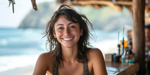 Joyful American Woman Smiling at a Beachside Embracing the Sun and Sea