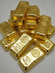 Detailed close-up of gold bars reflecting light, emphasizing value and investment potential, wealth imagery