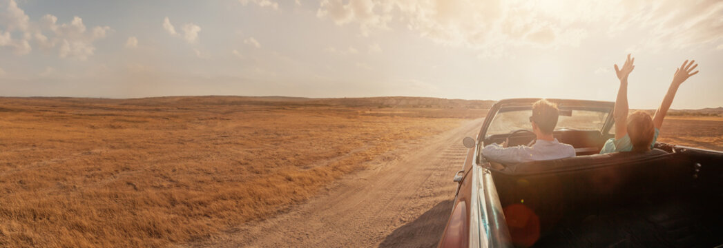 road trip, travel by car, romantic holidays for couple, honeymoon, happy man and woman in vintage convertible classic car, banner background
