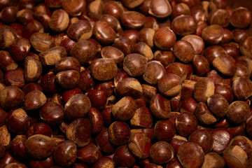 Roasted chestnuts background, Close-up of a pile of sweet chestnuts for background use