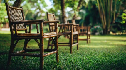 A row of wooden chairs situated on a lush green grassy area