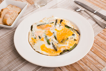 Scrambled eggs with asparagus for breakfast