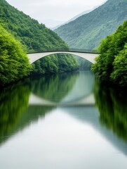Fototapeta premium Scenic riverside with a charming bridge, surrounded by lush greenery and tranquil waters.
