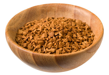 Freeze dried coffee powder in a wooden bowl, isolated on white background.