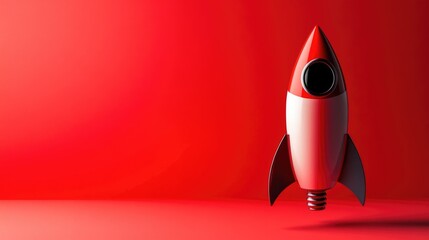 Fototapeta premium Red decorative rocket on a vibrant red background