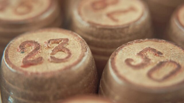 Hyper Macro steady shot of Bingo wooden barrels on a rotating stand, rotating 360, lucky numbers, 4K