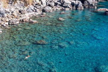 A Perfect Day in Paradise: Father and Daughter Explore a Stunning Cove