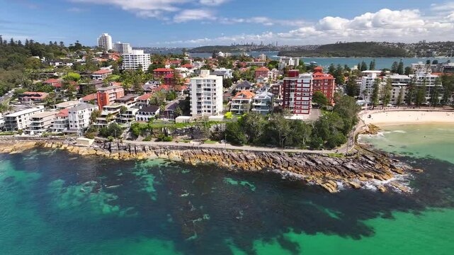 Love Manly Beach With Rocky Shore On Marine Parade, Manly NSW, Australia. Aerial Drone Shot