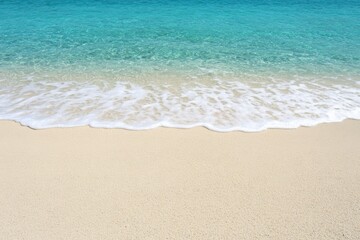 A beach with a wave coming in to the water - Outdoor