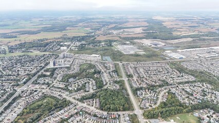 Aerial view of suburban neighborhoods and greenery.