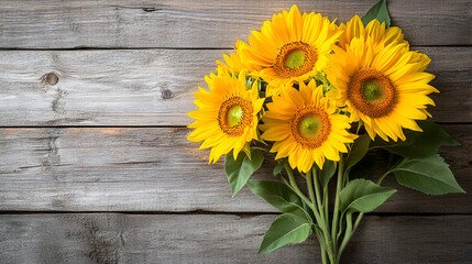 Obraz premium Autumn background with a bouquet of yellow sunflowers on vintage textured wooden table Sunflower isolated on wooden background. Border of decorative with gift box 