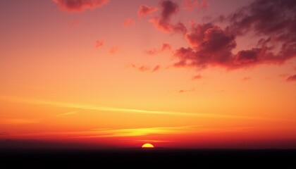 Sunset with Red and Orange Clouds over a Silhouetted Horizon