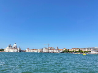 Naklejka premium A fun ride on a speedboat along the canals of Venice enjoying the beauty of ancient and modern Venetian architecture.