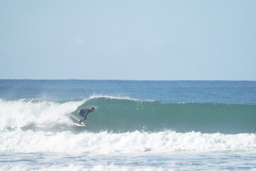 surfing sports in the waves in portugal during the winter season 