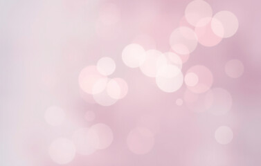 Pastel toned bokeh background filled with soft pink and teal lights