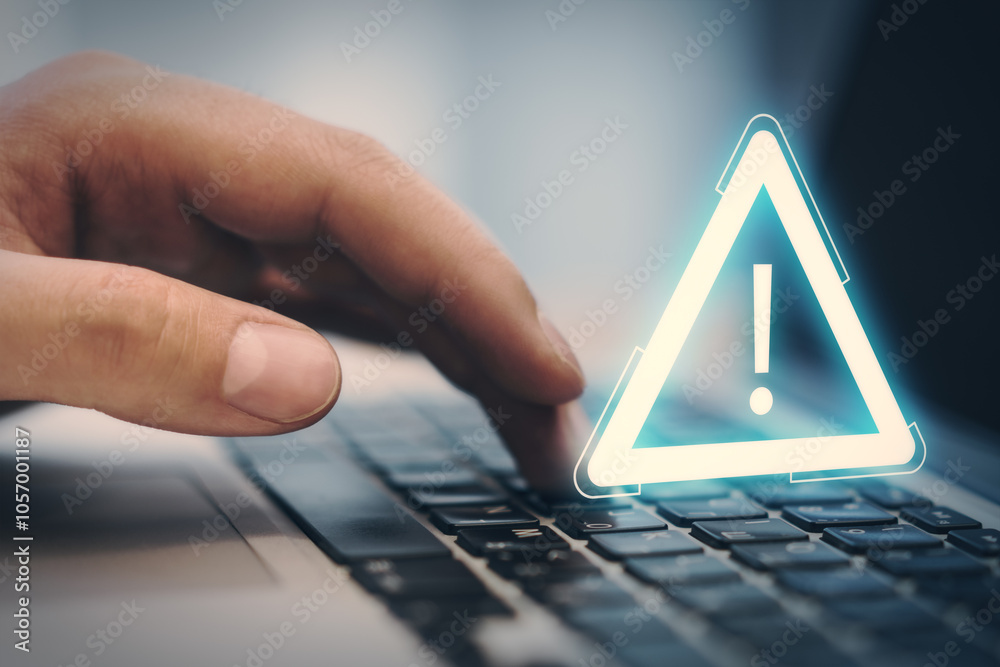 Poster Close up and side view of man hand using notebook keyboard with glowing attention sign on blurry background. Important notice and alert concept.