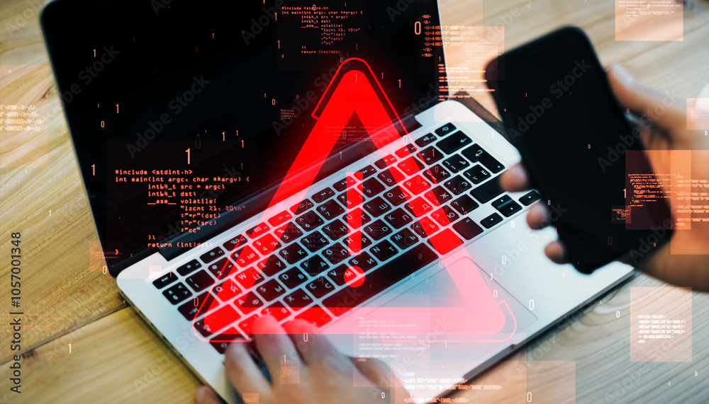 Poster Close up and top view of male hands using laptop keyboard and cellphone with glowing red attention sign on blurry background. Important notice and alert concept.