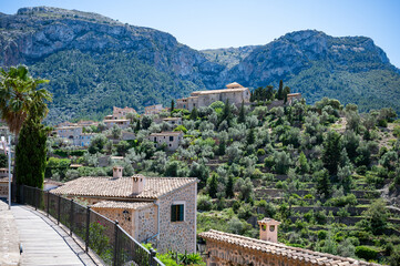 Deia, Mallorca mountain village cityscape with mountain range, wide angle shot, majorca spain