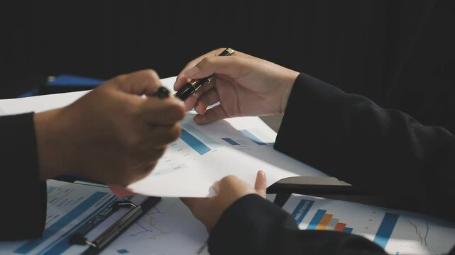 Fund managers team consultation and discuss about analysis Investment stock market at office