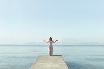 purification of soul and body of a woman meditating in front of the sea