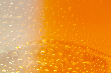 Water droplets on golden orange color background. Water droplets concept
