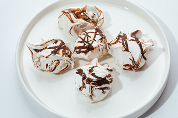 cakes with berries, chocolate and nuts on a white background
