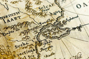 Obraz premium A detailed vintage map highlights a coastline with intricate illustrations, showcasing historical cartography and exploration artistry.