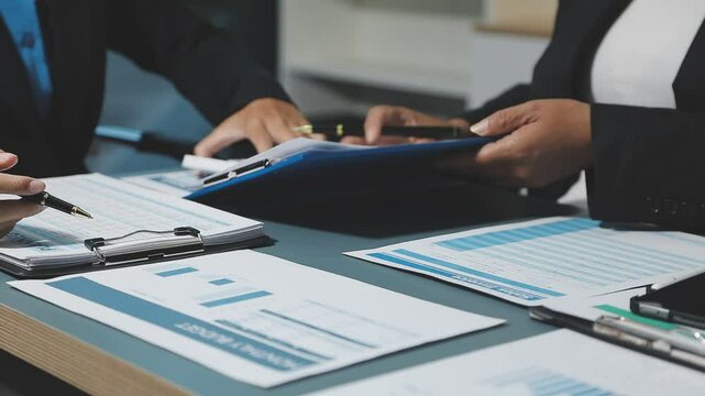 Fund managers team consultation and discuss about analysis Investment stock market at office