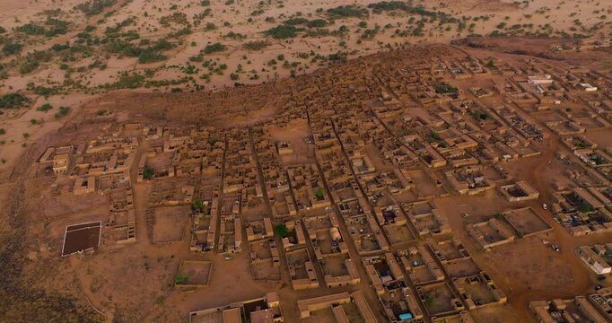 Aerial View Over Ouadane At Sunrise In Central Mauritania - Drone Shot
