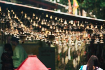 Obraz premium Close-up of temple bells with blurred background.
