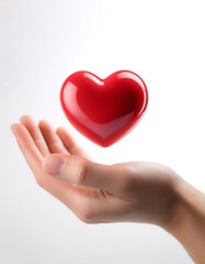 hand holding red heart love floating or flying isolated white background