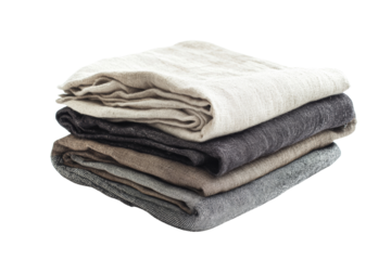 Stack of soft, folded linen fabric in neutral colors on a white isolated background.