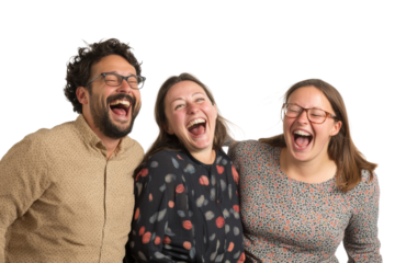 Three friends laughing joyfully together, capturing a moment of happiness and camaraderie.