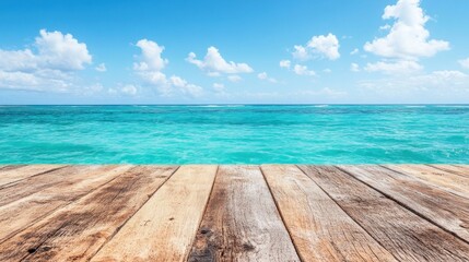 Fototapeta premium The wooden deck provides a stunning view of the vibrant turquoise ocean under a clear blue sky, dotted with fluffy clouds, creating a perfect beach getaway atmosphere