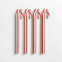 Four festive candy canes arranged on a white background, perfect for holiday-themed decorations.