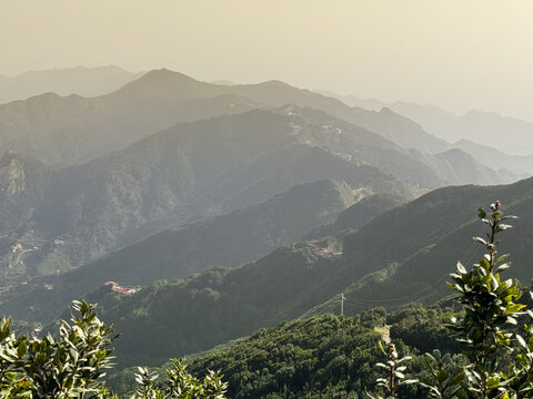 Calima in Tenerife. Majestic Mountain Landscape with Lush Greenery and Rolling Hills Under a Clear Sky