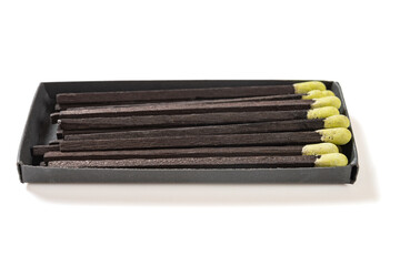 angle view green matchbox on a white background at horizontal composition