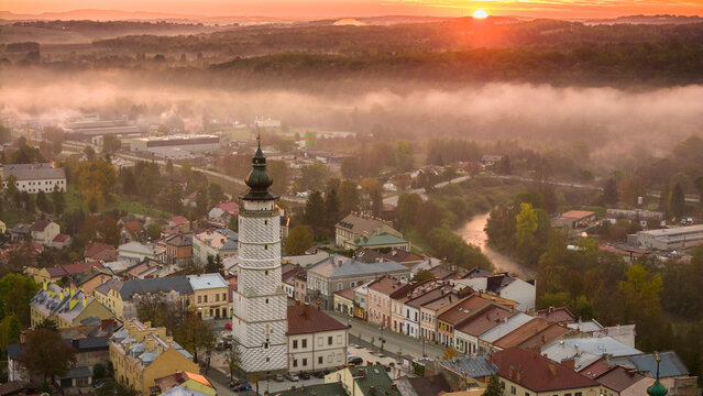 Aerial drone view of Biecz medieval townscape at foggy sunrise, Poland