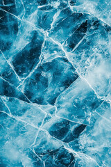 Vertical Abstract natural ice texture. Freezy ice surface. Blue backdrop with cracks and scratches on frozen water. Banner.