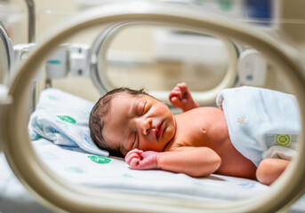 Newborn baby in incubator for neonatal care and health monitoring. Prematurity awareness month. World prematurity day 17 november