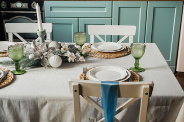 Elegant indoor dining table set for a festive meal with decorative accents