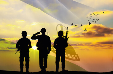 Silhouettes of soldiers with a background of the Lesotho flag and a sunset or sunrise. Concept of national holidays. Commemoration Day.