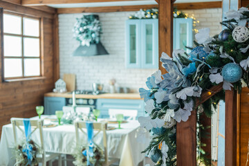 Cozy winter dining setup with festive decorations in a rustic kitchen