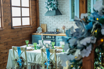 Cozy kitchen dining area decorated for a festive gathering with green accents