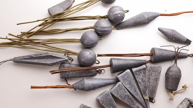 Old lead fishing sinkers on a white background. fishing tools.