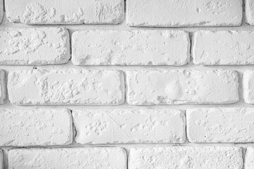 Clean white brick wall texture with uneven surface in modern interior design