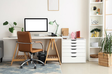 Interior of living room with workplace and shelf unit