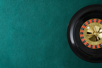 Casino roulette background on green felt game mat