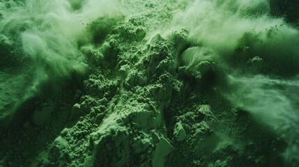 Fototapeta premium Explosion of green powder pile, solid color background,