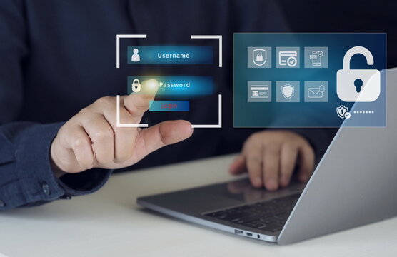 Businessman typing on keyboard laptop computer to input username and password for technology security system and prevent hacker concept.